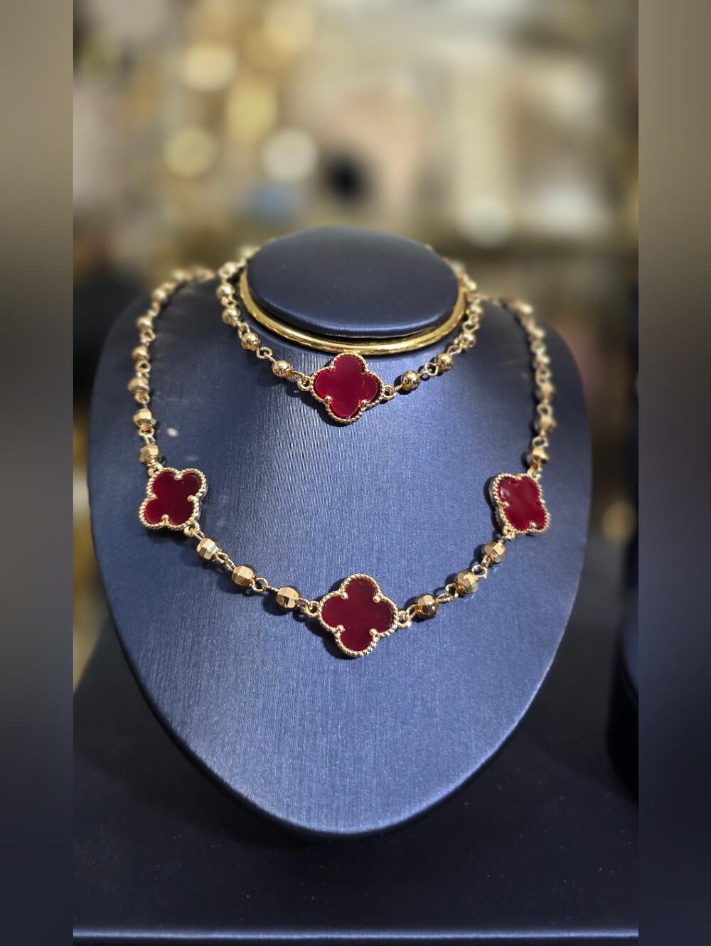 Gold Plated Necklace Set with Red Clover Motifs.
